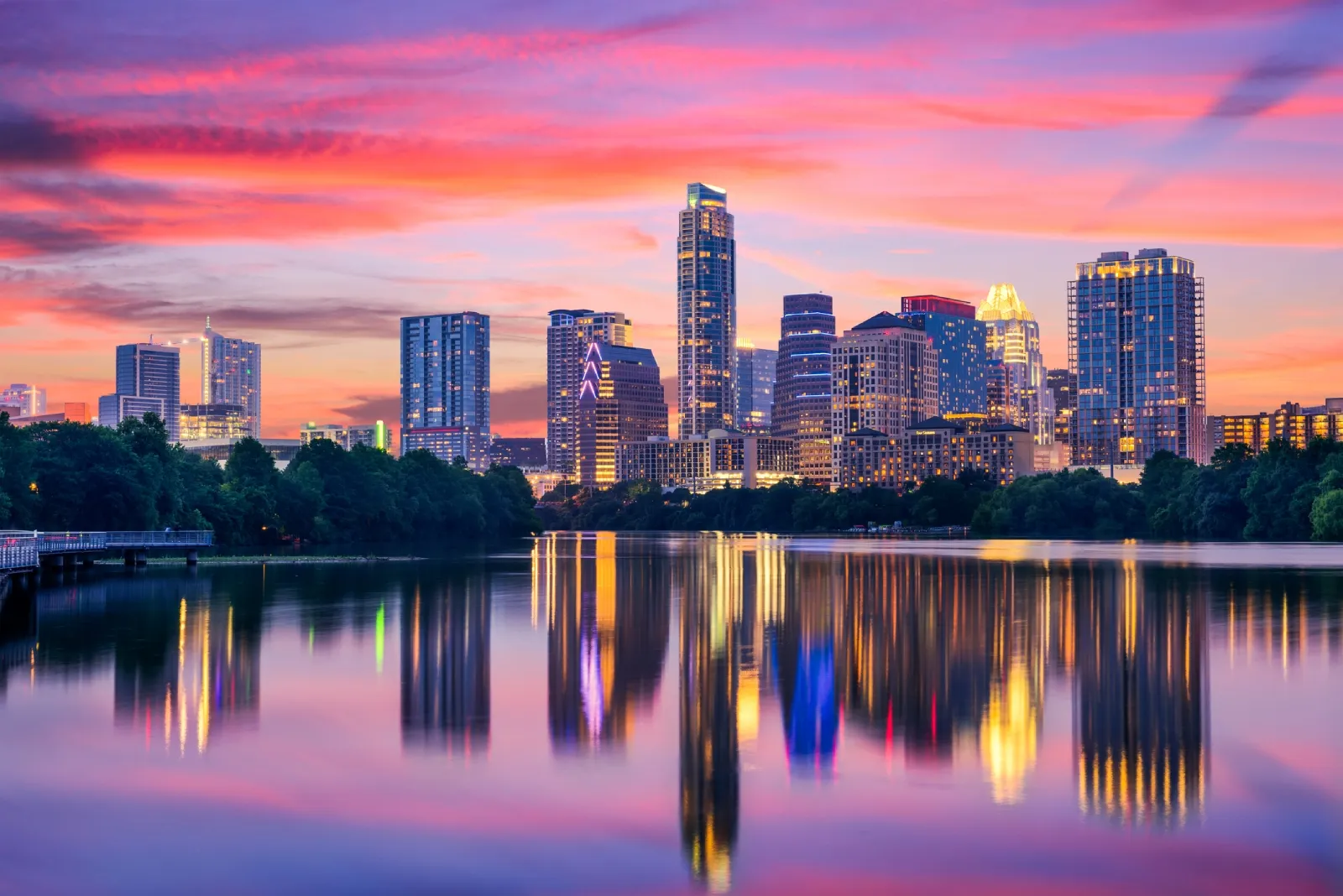 The downtown Austin, Texas skyline reflected in Lady Bird Lake at sunset